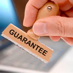 Picture explaining the importance of Job Guarantee with a paper stamp mentioning guarantee on it