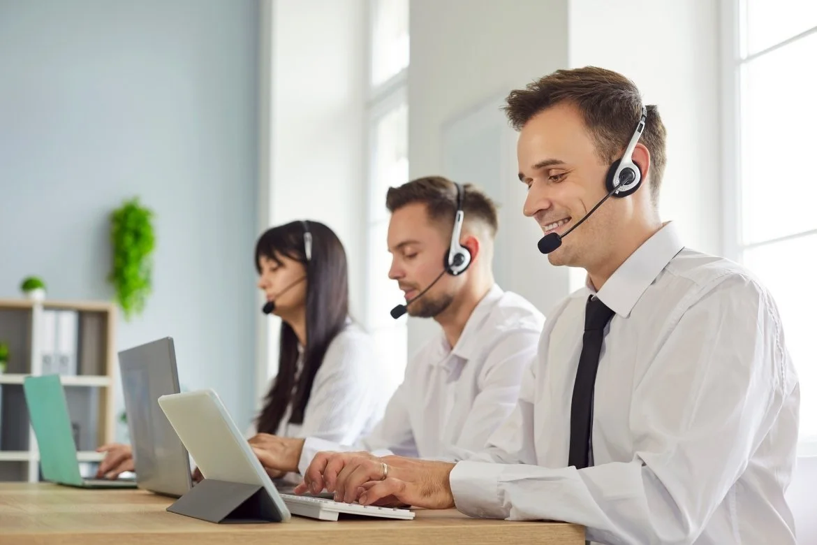 IT Help Desk Members working in Office
